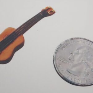 Sand Play Therapy Tiny Guitar.jpg